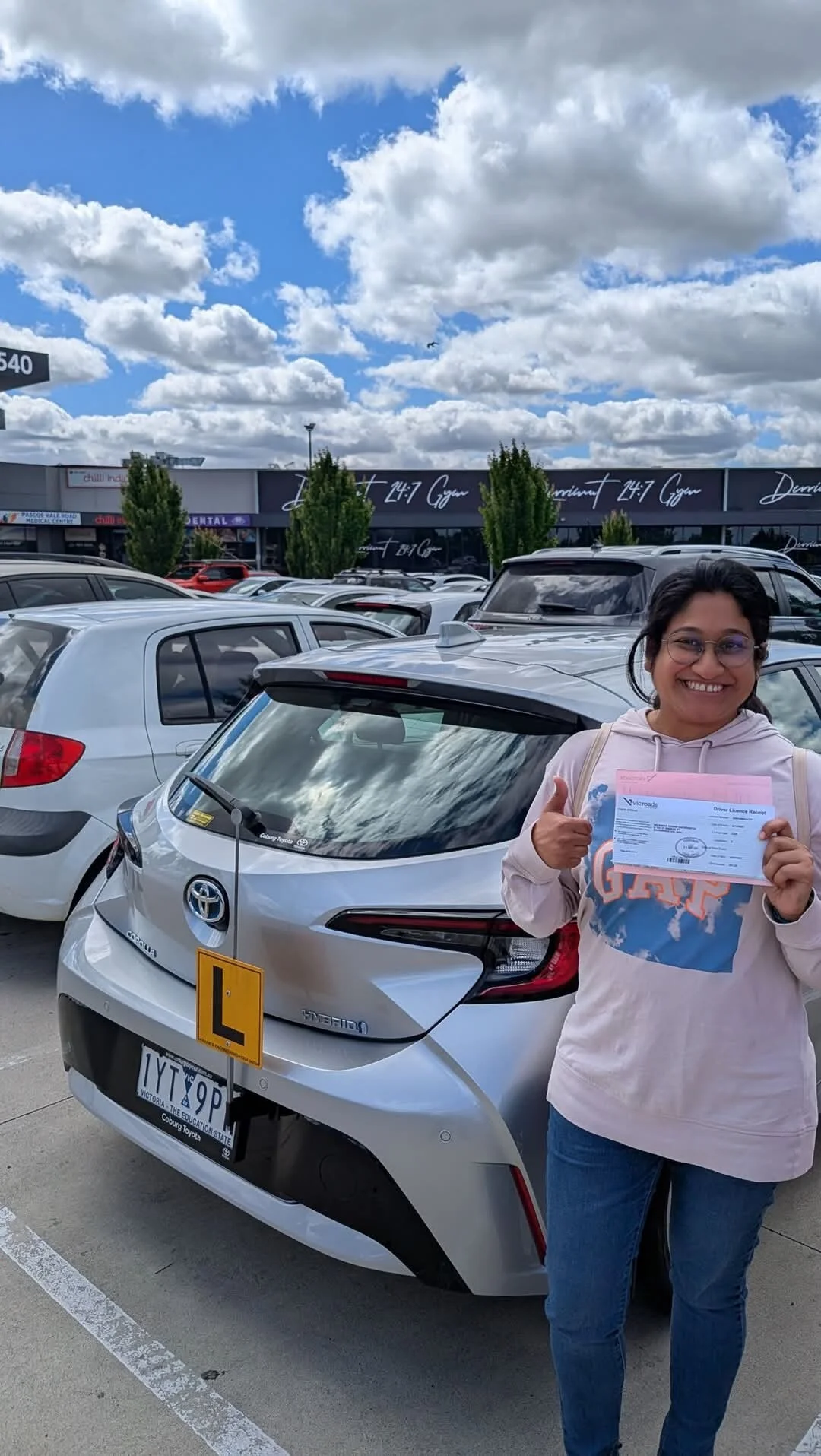 Student thumbs up VicRoads driving test pass