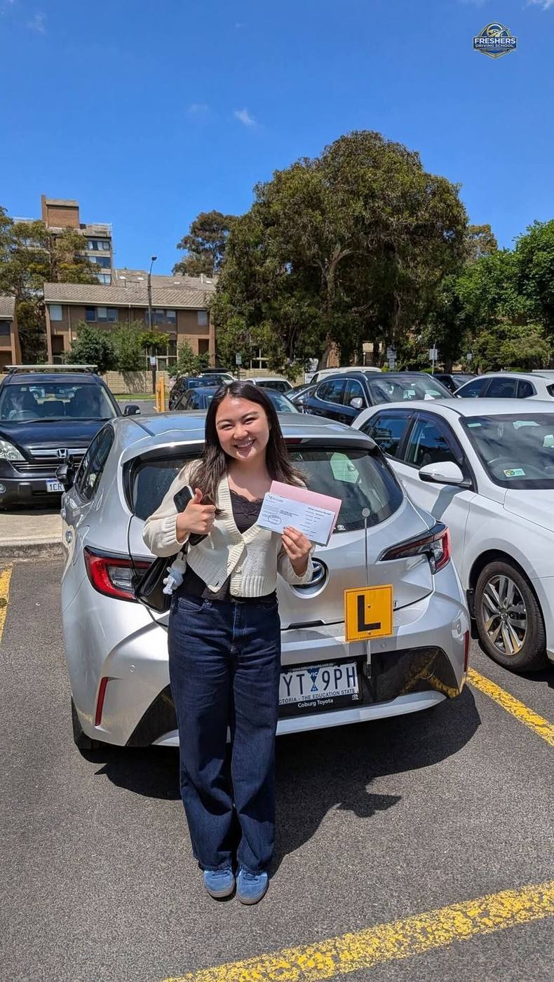 Freshers Driving School student celebrating VicRoads drive test pass in Melbourne